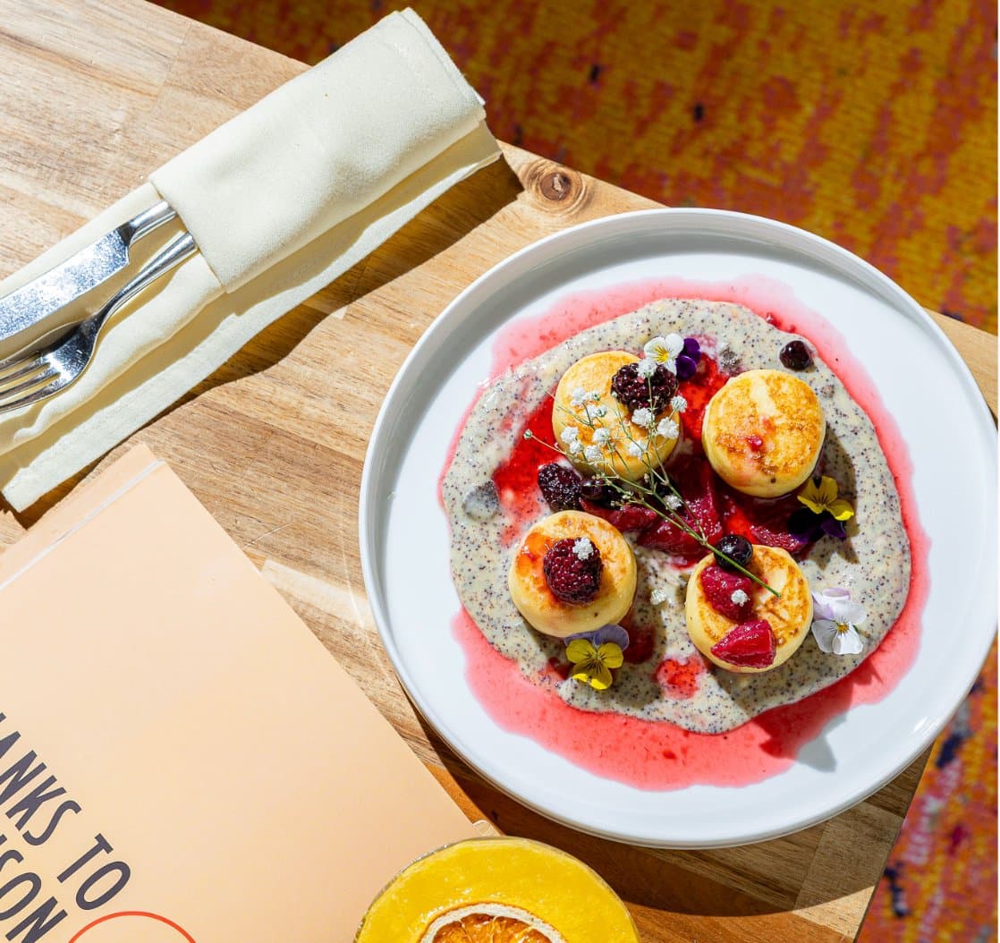 Syrnyky with custard cream, poppy seeds and berry compote at Thanks to Harrison